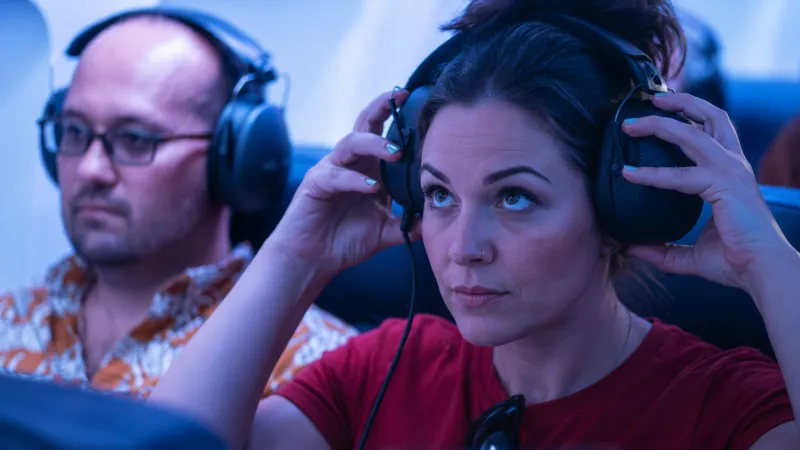 A FLIGHT audience member in headphones